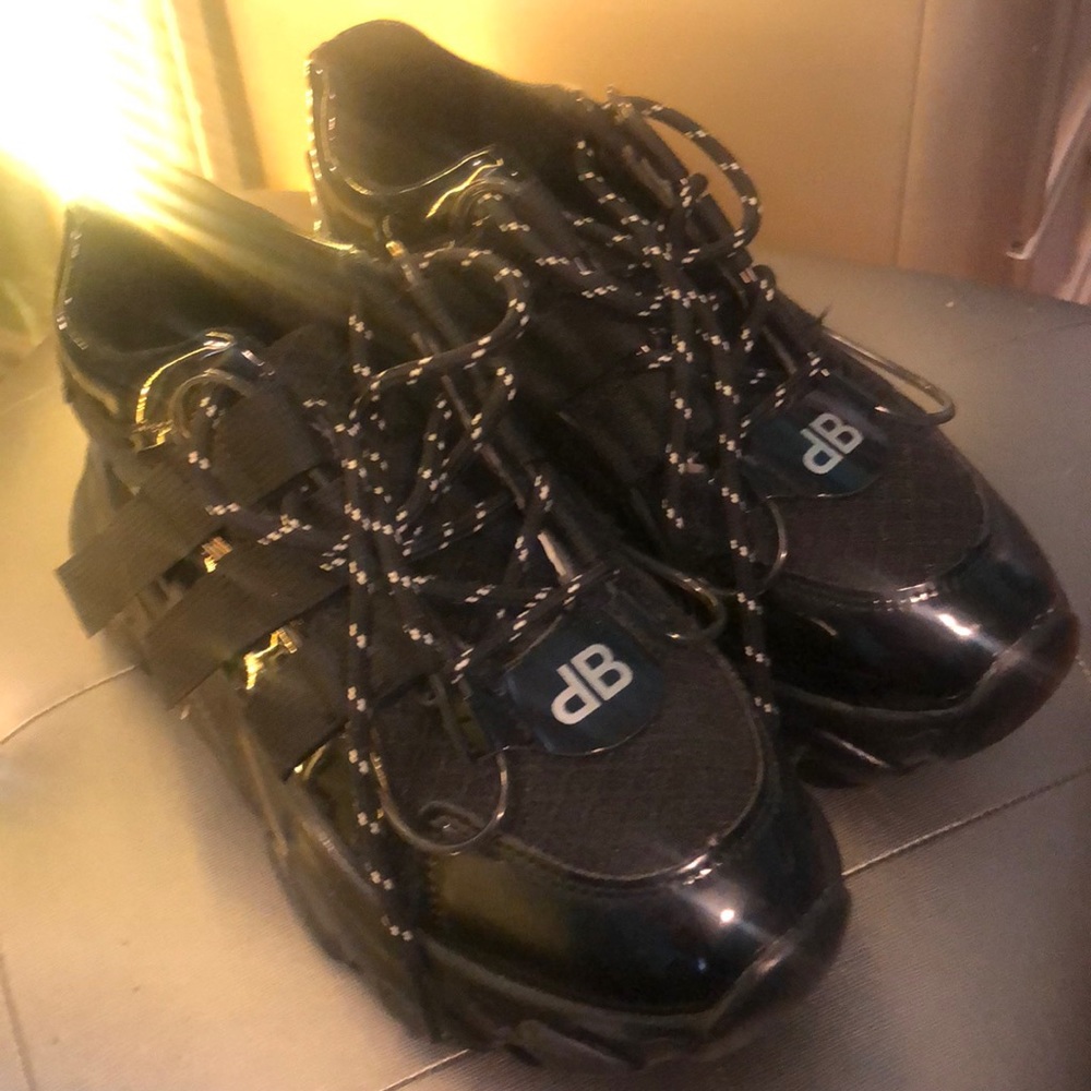 Shiny black sneakers